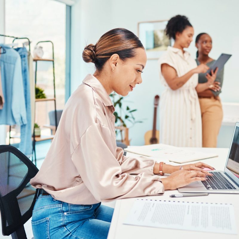 Office, typing or designer with laptop for fashion design, plan or online draft for small business